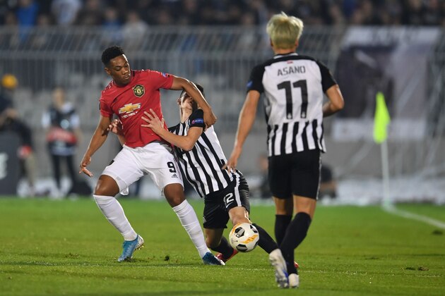 FK Partizan's Serbian defender Slobodan Urosevic tackles Manchester United's French striker Anthony Martial (L) during the UEFA Europa league group L football match between Partizan Belgrade and Manchester United at the Partizan stadium in Belgrade on October 24, 2019. (Photo by ANDREJ ISAKOVIC / AFP) (Photo by ANDREJ ISAKOVIC/AFP via Getty Images)