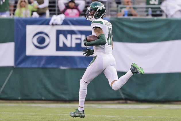New York Jets' Robby Anderson looks back as he runs for a touchdown during the first half of an NFL football game against the Dallas Cowboys, Sunday, Oct. 13, 2019, in East Rutherford, N.J. (AP Photo/Frank Franklin II)