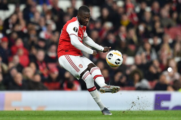 Arsenal's French-born Ivorian midfielder Nicolas Pepe takes a free-kick to scores his team's second goal during their UEFA Europa league Group F football match between Arsenal and Vitoria Guimaraes at the Emirates stadium in London on October 24, 2019. (Photo by Glyn KIRK / AFP) (Photo by GLYN KIRK/AFP via Getty Images)