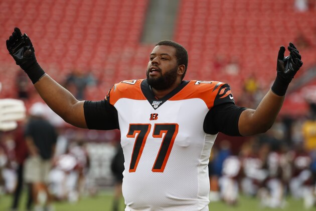 Cincinnati Bengals offensive tackle Cordy Glenn (77) warms up before an NFL preseason football game against the Washington Redskins, Thursday, Aug. 15, 2019, in Landover, Md. (AP Photo/Alex Brandon)
