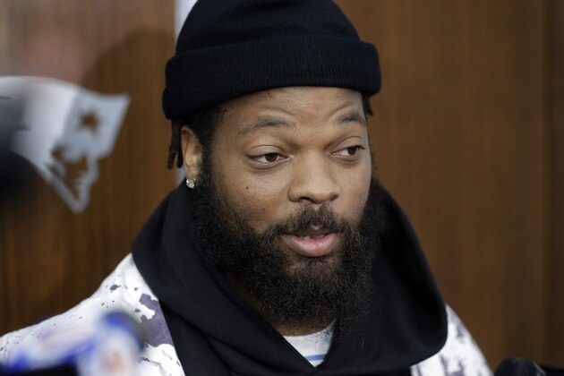 New England Patriots defensive lineman Michael Bennett speaks with members of the media in the team's locker room following NFL football practice, Wednesday, Oct. 23, 2019, in Foxborough, Mass. (AP Photo/Steven Senne)