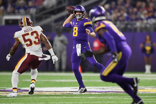 MINNEAPOLIS, MINNESOTA - OCTOBER 24: Quarterback Kirk Cousins #8 of the Minnesota Vikings looks to deliver a pass against the defense of  Jon Bostic #53 of the Washington Redskins during the game at U.S. Bank Stadium on October 24, 2019 in Minneapolis, Minnesota. (Photo by Hannah Foslien/Getty Images)