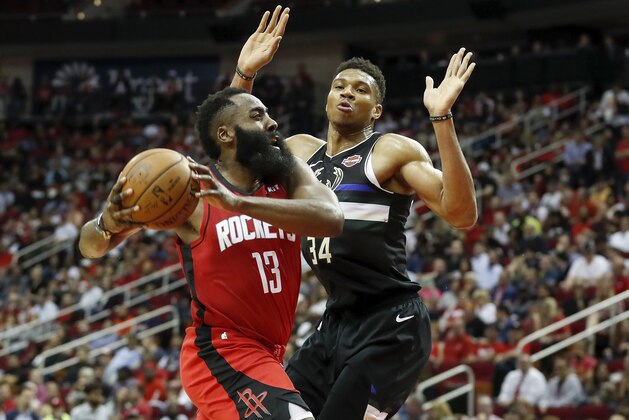 HOUSTON, TX - OCTOBER 24:  James Harden #13 of the Houston Rockets drives to the basket defended by Giannis Antetokounmpo #34 of the Milwaukee Bucks in the second half at Toyota Center on October 24, 2019 in Houston, Texas.  NOTE TO USER: User expressly acknowledges and agrees that, by downloading and or using this photograph, User is consenting to the terms and conditions of the Getty Images License Agreement.  (Photo by Tim Warner/Getty Images)