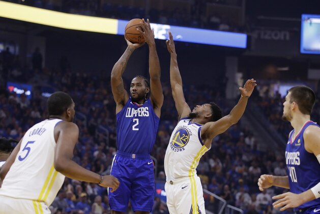 Los Angeles Clippers' Kawhi Leonard (2) shoots next to Golden State Warriors' Glenn Robinson III (22) during the first half of an NBA basketball game Thursday, Oct. 24, 2019, in San Francisco. (AP Photo/Ben Margot)