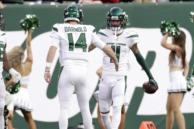 New York Jets quarterback Sam Darnold (14) celebrates a touchdown with Robby Anderson (11) during the first half of an NFL football game against the Dallas Cowboys, Sunday, Oct. 13, 2019, in East Rutherford, N.J. (AP Photo/Adam Hunger)