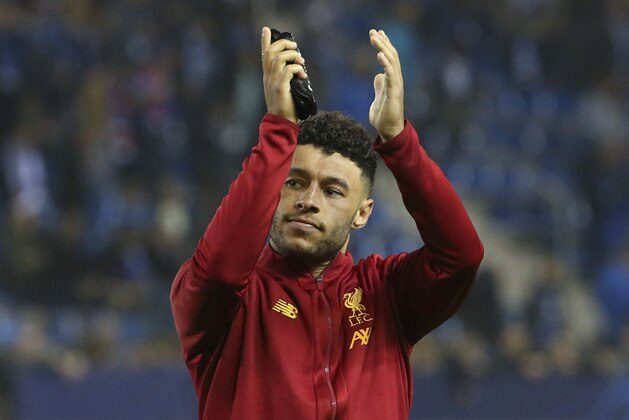 GENK, BELGIUM - OCTOBER 23: Alex Oxlade-Chamberlain of Liverpool celebrates the victory with his supporters following the UEFA Champions League group E match between KRC Genk and Liverpool FC at Luminus Arena on October 23, 2019 in Genk, Belgium. (Photo by Jean Catuffe/Getty Images)