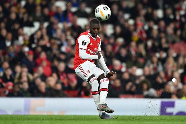 Arsenal's French-born Ivorian midfielder Nicolas Pepe takes a free-kick to scores his team's second goal during their UEFA Europa league Group F football match between Arsenal and Vitoria Guimaraes at the Emirates stadium in London on October 24, 2019. (Photo by Glyn KIRK / AFP) (Photo by GLYN KIRK/AFP via Getty Images)