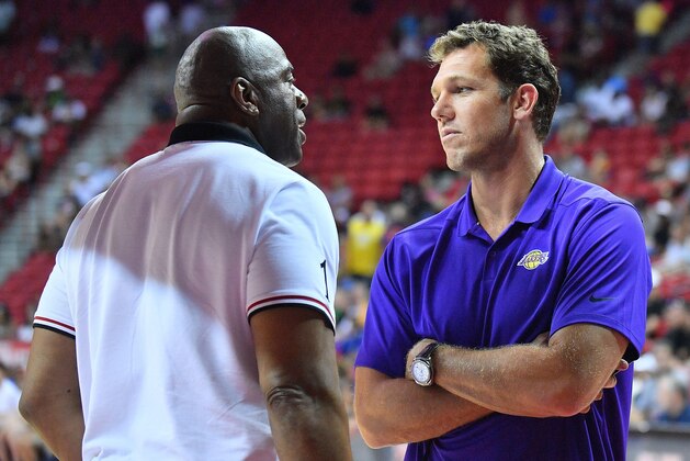 LAS VEGAS, NV - JULY 10:  Head coach Luke Walton of the Los Angeles Lakers talks with Los Angeles Lakers president of basketball operations Earvin 'Magic' Johnson during the 2018 NBA Summer League at the Thomas & Mack Center on July 10, 2018 in Las Vegas, Nevada. The Lakers defeated the Knicks 109-92. NOTE TO USER: User expressly acknowledges and agrees that, by downloading and or using this photograph, User is consenting to the terms and conditions of the Getty Images License Agreement.  (Photo by Sam Wasson/Getty Images)
