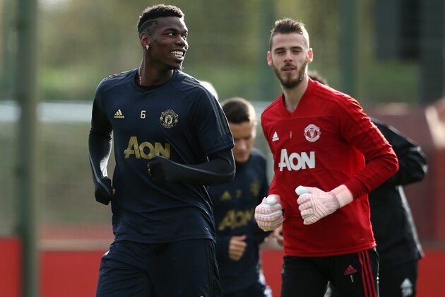 MANCHESTER, ENGLAND - OCTOBER 22:  Paul Pogba  and David De Gea of Manchester United warm up during a training session ahead of their UEFA Champions League Group H match against Juventus at Aon Training Complex on October 22, 2018 in Manchester, England.  (Photo by Jan Kruger/Getty Images)