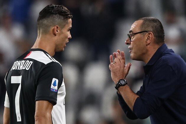 Juventus' Italian coach Maurizio Sarri (R) gives instructions to Juventus' Portuguese forward Cristiano Ronaldo during the Italian Serie A football match Juventus vs Verona on September 21, 2019 at the Juventus stadium in Turin. (Photo by Isabella BONOTTO / AFP)        (Photo credit should read ISABELLA BONOTTO/AFP/Getty Images)