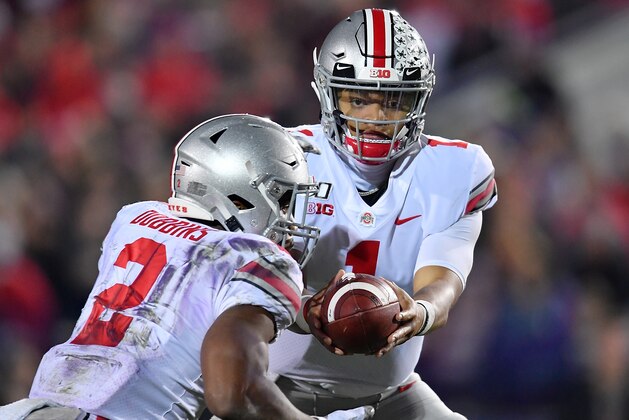 EVANSTON, ILLINOIS - OCTOBER 18: Justin Fields #1 of the Ohio State Buckeyes looks to hand the football to J.K. Dobbins #2 of the Ohio State Buckeyes against the Northwestern Wildcats at Ryan Field on October 18, 2019 in Evanston, Illinois. (Photo by Quinn Harris/Getty Images)