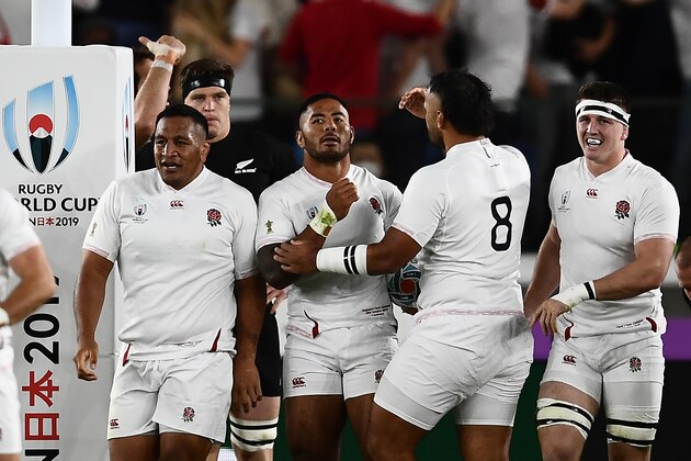 England's centre Manu Tuilagi (C) celebrates with teammates after scoring a try  during the Japan 2019 Rugby World Cup semi-final match between England and New Zealand at the International Stadium Yokohama in Yokohama on October 26, 2019. (Photo by CHARLY TRIBALLEAU / AFP) (Photo by CHARLY TRIBALLEAU/AFP via Getty Images)