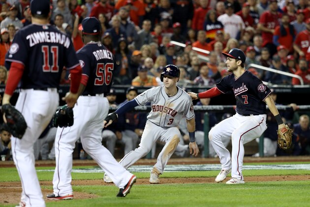WASHINGTON, DC - OCTOBER 25:  Kyle Tucker #3 of the Houston Astros is caught in a rundown by Trea Turner #7 of the Washington Nationals during the sixth inningin Game Three of the 2019 World Series at Nationals Park on October 25, 2019 in Washington, DC. (Photo by Rob Carr/Getty Images)