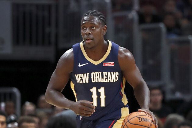 New Orleans Pelicans' Jrue Holiday brings the ball up court during the first half of an NBA preseason basketball game against the Chicago Bulls Wednesday, Oct. 9, 2019, in Chicago. (AP Photo/Charles Rex Arbogast)