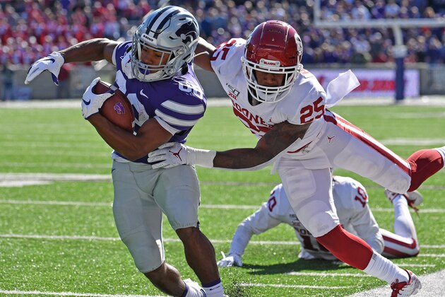 MANHATTAN, KS - OCTOBER 26:  Wide receiver Phillip Brooks #88 of the Kansas State Wildcats gets tackled short of the goal line by safety Justin Broiles #25 of the Oklahoma Sooners during the second half at Bill Snyder Family Football Stadium on October 26, 2019 in Manhattan, Kansas. (Photo by Peter G. Aiken/Getty Images)
