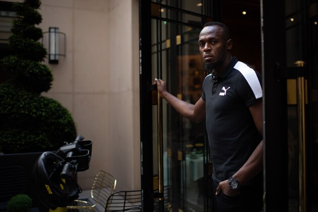 Jamaican Olympic sprinter Usain Bolt poses during a photo session as he launches a new brand of electric scooters named