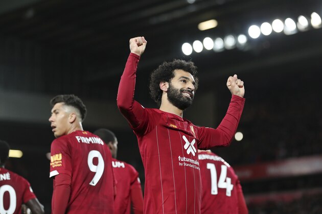 Liverpool's Mohamed Salah celebrates after scoring his side's second goal during the English Premier League soccer match between Liverpool and Tottenham Hotspur at Anfield stadium in Liverpool, England, Sunday, Oct. 27, 2019. (AP Photo/Jon Super)