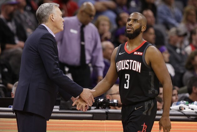 Houston Rockets head coach Mike D'Antoni, left, shakes hands with guard Chris Paul as he leaves the game in the final moments of the Rockets' 130-105 win over the Sacramento Kings in an NBA basketball game, Tuesday, April 2, 2019, in Sacramento, Calif. (AP Photo/Rich Pedroncelli)
