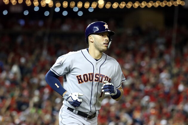 WASHINGTON, DC - OCTOBER 27:  Carlos Correa #1 of the Houston Astros hits a two-run home run against the Washington Nationals during the fourth inning in Game Five of the 2019 World Series at Nationals Park on October 27, 2019 in Washington, DC. (Photo by Rob Carr/Getty Images)