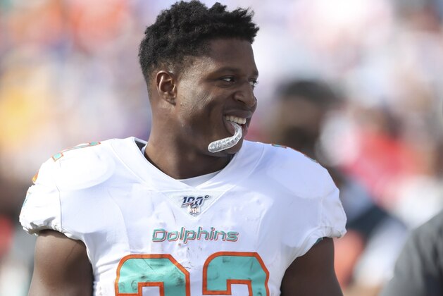 Miami Dolphins running back Kenyan Drake stands on the sideline in the first half of an NFL football game against the Buffalo Bills, Sunday, Oct. 20, 2019, in Orchard Park, N.Y. (AP Photo/Ron Schwane)