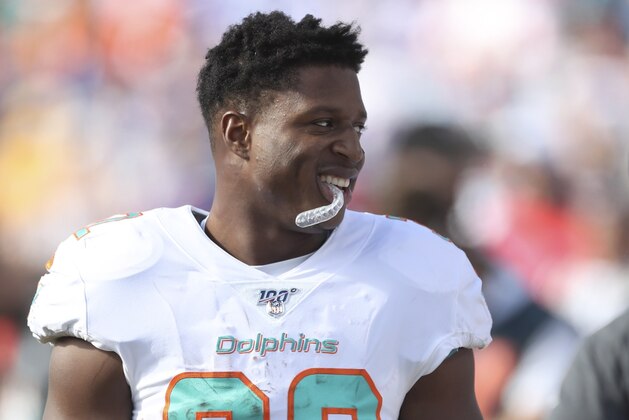 Miami Dolphins running back Kenyan Drake stands on the sideline in the first half of an NFL football game against the Buffalo Bills, Sunday, Oct. 20, 2019, in Orchard Park, N.Y. (AP Photo/Ron Schwane)