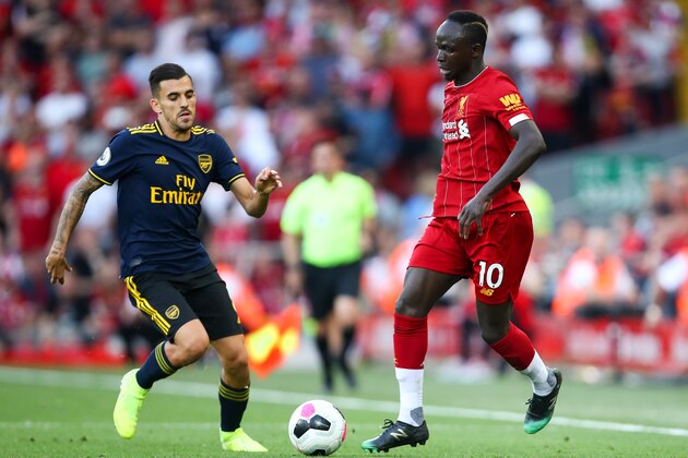 LIVERPOOL, ENGLAND - AUGUST 24: Dani Ceballos of Arsenal and Sadio Mane of Liverpool during the Premier League match between Liverpool FC and Arsenal FC at Anfield on August 24, 2019 in Liverpool, United Kingdom. (Photo by Robbie Jay Barratt - AMA/Getty Images)