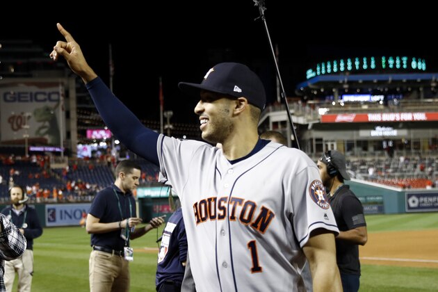 Houston Astros shortstop Carlos Correa walks off the field after Game 5 of the baseball World Series Washington Nationals Sunday, Oct. 27, 2019, in Washington. The Astros won 7-1 to take a 3-2 lead in the series. (AP Photo/Patrick Semansky)