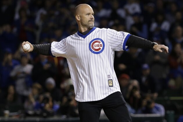 Former Chicago Cubs player David Ross throws a ceremonial first pitch before Game 5 of baseball's National League Championship Series between the Chicago Cubs and the Los Angeles Dodgers, Thursday, Oct. 19, 2017, in Chicago. (AP Photo/Nam Y. Huh)