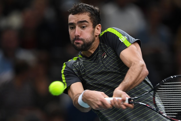 Croatia's Marin Cilic eyes the ball as he returns the ball to Poland's Hubert Hurkacz during their men's singles tennis match on day one of the ATP World Tour Masters 1000 - Rolex Paris Masters - indoor tennis tournament at The AccorHotels Arena in Paris on October 28, 2019. (Photo by Christophe ARCHAMBAULT / AFP) (Photo by CHRISTOPHE ARCHAMBAULT/AFP via Getty Images)