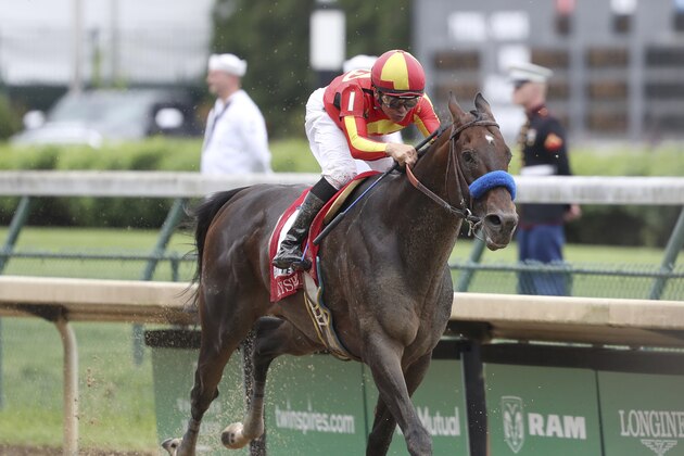 FILE - In this May 3, 2019, file photo, McKinzie, ridden by jockey Mike Smith, wins the Grade 2 Alysheba horse race at Churchill Downs in Louisville, Ky. The Breeders’ Cup Classic pits West Coast star McKinzie against Code of Honor, the East’s top horse who finished second in the Kentucky Derby. (AP Photo/Gregory Payan, File)