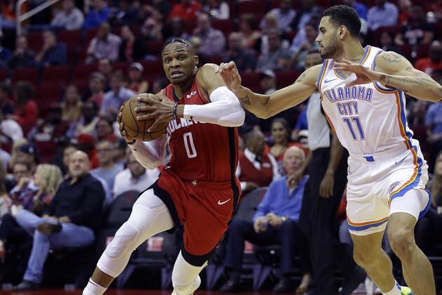 HOUSTON, TEXAS - OCTOBER 28: Russell Westbrook #0 of the Houston Rockets drives past  Abdel Nader #11 of the Oklahoma City Thunder to the basket during the second quarter at Toyota Center on October 28, 2019 in Houston, Texas.NOTE TO USER: User expressly acknowledges and agrees that, by downloading and/or using this photograph, user is consenting to the terms and conditions of the Getty Images License Agreement.  (Photo by Bob Levey/Getty Images)