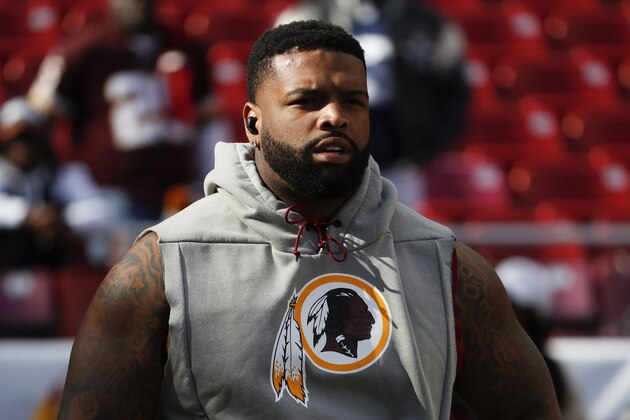 Washington Redskins offensive tackle Trent Williams (71) takes the field for warms up before an NFL football game against the Dallas Cowboys Sunday, Oct. 21, 2018, in Landover, Md. (AP Photo/Andrew Harnik)