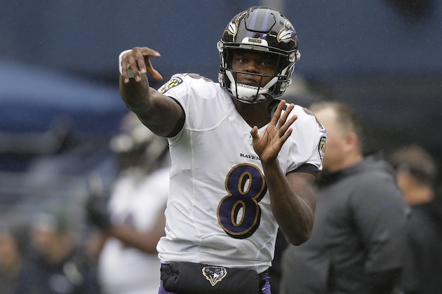 Baltimore Ravens quarterback Lamar Jackson passes before an NFL football game against the Seattle Seahawks, Sunday, Oct. 20, 2019, in Seattle. (AP Photo/John Froschauer)