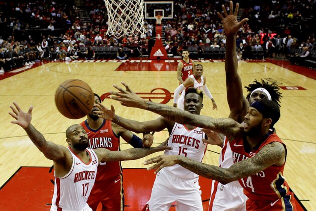 New Orleans Pelicans forward Brandon Ingram, right, passes the ball during the second half of an NBA basketball game against the Houston Rockets, Saturday, Oct. 26, 2019, in Houston. (AP Photo/Eric Christian Smith)