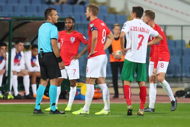 SOFIA, BULGARIA - OCTOBER 14: Raheem Sterling of England watches as captain Harry Kane speaks with referee Ivan Bebek during the UEFA Euro 2020 qualifier between Bulgaria and England on October 14, 2019 in Sofia, Bulgaria. (Photo by Catherine Ivill/Getty Images)