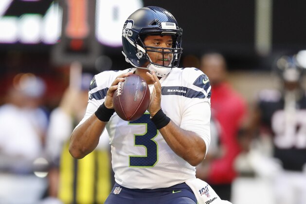 ATLANTA, GA - OCTOBER 27: Russell Wilson #3 of the Seattle Seahawks drops back to pass in the first half of an NFL game against the Atlanta Falcons at Mercedes-Benz Stadium on October 27, 2019 in Atlanta, Georgia. (Photo by Todd Kirkland/Getty Images)