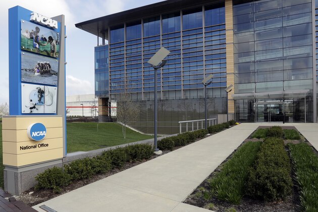 FILE - This is an April 25, 2018, file photo, showing NCAA headquarters in Indianapolis. The NCAA Board of Governors took the first step Tuesday, Oct. 29, 2019, toward allowing athletes to cash in on their fame, voting unanimously to clear the way for the amateur athletes to