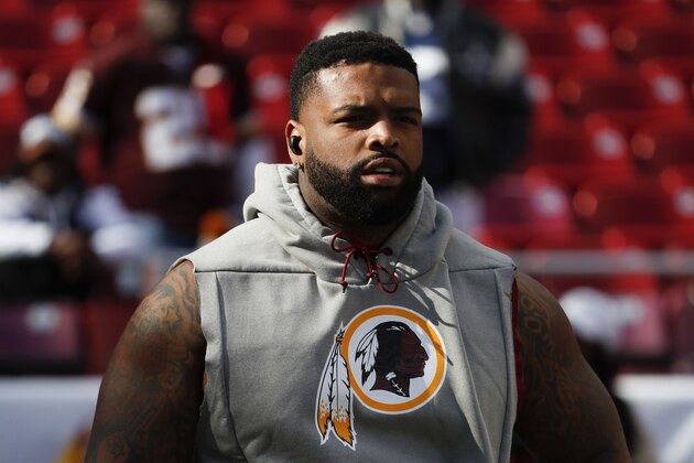 Washington Redskins offensive tackle Trent Williams (71) takes the field for warms up before an NFL football game against the Dallas Cowboys Sunday, Oct. 21, 2018, in Landover, Md. (AP Photo/Andrew Harnik)