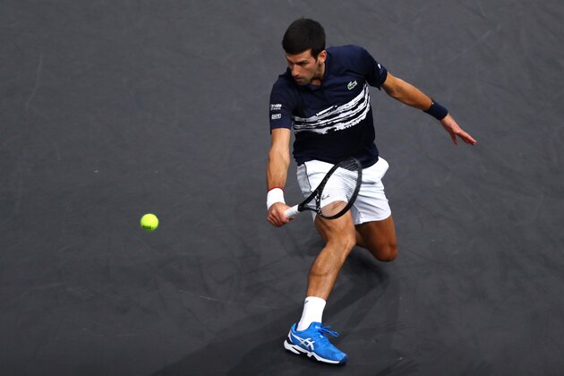 PARIS, FRANCE - OCTOBER 30:  Novak Djokovic of Serbia returns a backhand in his match against Corentin Moutet of France on day 3 of the Rolex Paris Masters, part of the ATP World Tour Masters 1000 held at the at AccorHotels Arena on October 30, 2019 in Paris, France. (Photo by Dean Mouhtaropoulos/Getty Images)