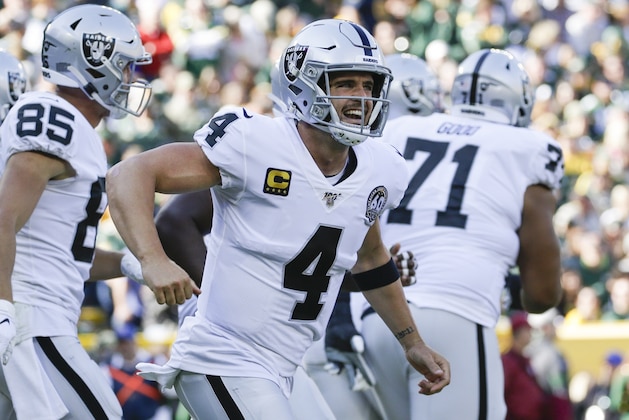 Oakland Raiders' Derek Carr celebrates after throwing a touchdown pass during the first half of an NFL football game against the Green Bay Packers Sunday, Oct. 20, 2019, in Green Bay, Wis. (AP Photo/Jeffrey Phelps)