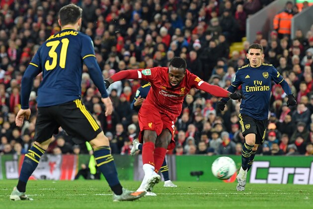 Liverpool's Belgium striker Divock Origi (C) scores his team's fourth goal during the English League Cup fourth round football match between Liverpool and Arsenal at Anfield in Liverpool, north west England on October 30, 2019. (Photo by Paul ELLIS / AFP) / RESTRICTED TO EDITORIAL USE. No use with unauthorized audio, video, data, fixture lists, club/league logos or 'live' services. Online in-match use limited to 75 images, no video emulation. No use in betting, games or single club/league/player publications. /  (Photo by PAUL ELLIS/AFP via Getty Images)