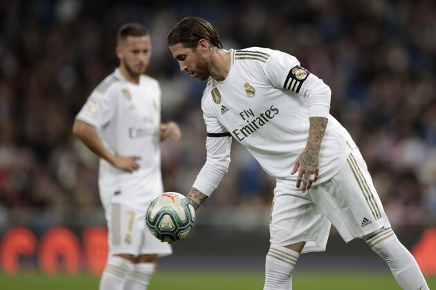 Real Madrid's Sergio Ramos places the ball for a penalty kick during a Spanish La Liga soccer match between Real Madrid and Leganes at the Santiago Bernabeu stadium in Madrid, Spain, Wednesday, Oct. 30, 2019. (AP Photo/Bernat Armangue)