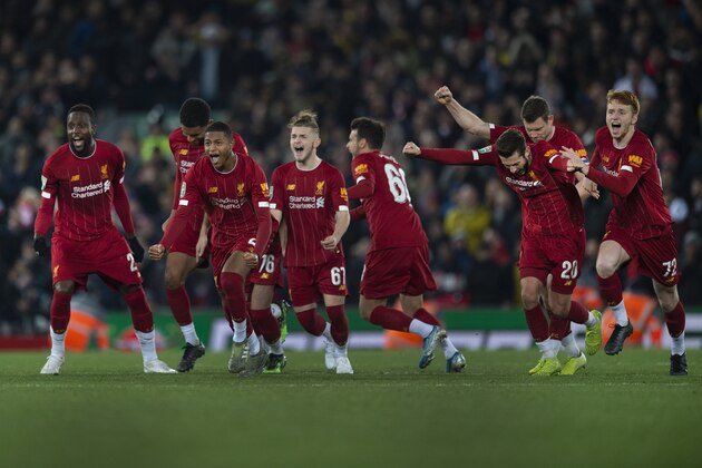 LIVERPOOL, ENGLAND - OCTOBER 30: The Liverpool team celebrate winning the penalty shoot out as Curtis Jones scores the winning penalty during the Carabao Cup Fourth Round match between Liverpool and Arsenal at the Anfield Stadium on October 30, 2019 in Manchester, England. (Photo by Visionhaus)