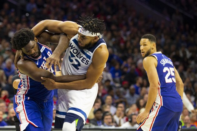 PHILADELPHIA, PA - OCTOBER 30: Joel Embiid #21 of the Philadelphia 76ers gets in a fight with Karl-Anthony Towns #32 of the Minnesota Timberwolves as Ben Simmons #25 looks on in the third quarter at the Wells Fargo Center on October 30, 2019 in Philadelphia, Pennsylvania. NOTE TO USER: User expressly acknowledges and agrees that, by downloading and or using this photograph, User is consenting to the terms and conditions of the Getty Images License Agreement. (Photo by Mitchell Leff/Getty Images)