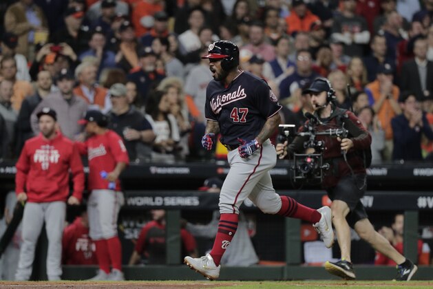 Washington Nationals' Howie Kendrick celebrates after hitting a two-run home run during the seventh inning of Game 7 of the baseball World Series against the Houston Astros Wednesday, Oct. 30, 2019, in Houston. (AP Photo/David J. Phillip)