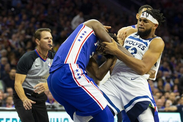 PHILADELPHIA, PA - OCTOBER 30: Joel Embiid #21 of the Philadelphia 76ers fights with Karl-Anthony Towns #32 of the Minnesota Timberwolves in the third quarter at the Wells Fargo Center on October 30, 2019 in Philadelphia, Pennsylvania. The 76ers defeated the Wolves 117-95. NOTE TO USER: User expressly acknowledges and agrees that, by downloading and or using this photograph, User is consenting to the terms and conditions of the Getty Images License Agreement. (Photo by Mitchell Leff/Getty Images)