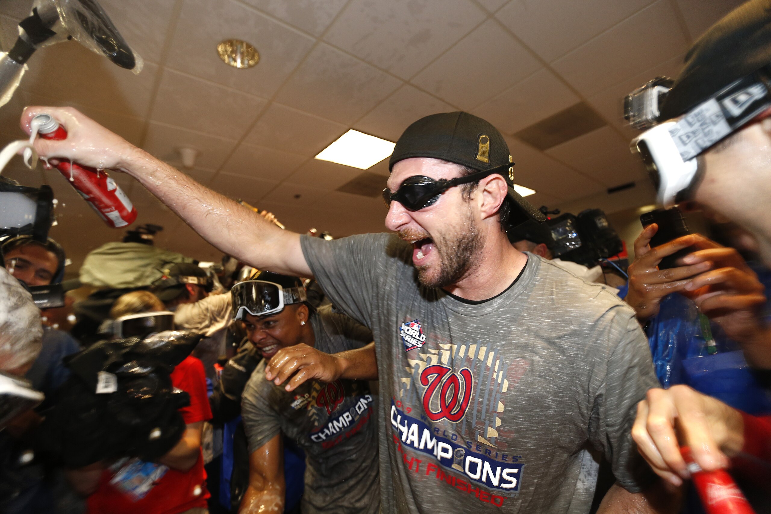 HOUSTON, TEXAS - OCTOBER 30:  Max Scherzer #31 of the Washington Nationals celebrates in the locker room after defeating the Houston Astros in Game Seven to win the 2019 World Series at Minute Maid Park on October 30, 2019 in Houston, Texas. The Washington Nationals defeated the Houston Astros with a score of 6 to 2. (Photo by Elsa/Getty Images)