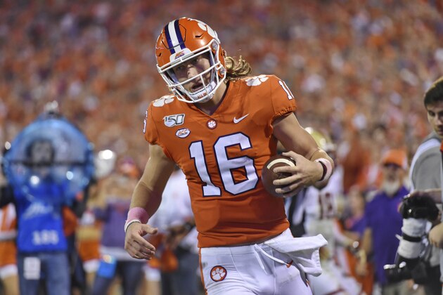 Clemson quarterback Trevor Lawrence runs through the endzone after rushing for a first down during the first half of an NCAA college football game against Boston College Saturday, Oct. 26, 2019, in Clemson, S.C. (AP Photo/Richard Shiro)