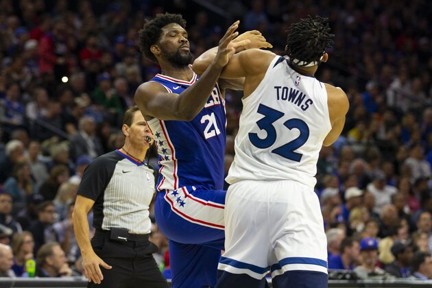 PHILADELPHIA, PA - OCTOBER 30: Joel Embiid #21 of the Philadelphia 76ers fights with Karl-Anthony Towns #32 of the Minnesota Timberwolves in the third quarter at the Wells Fargo Center on October 30, 2019 in Philadelphia, Pennsylvania. The 76ers defeated the Wolves 117-95. NOTE TO USER: User expressly acknowledges and agrees that, by downloading and or using this photograph, User is consenting to the terms and conditions of the Getty Images License Agreement. (Photo by Mitchell Leff/Getty Images)