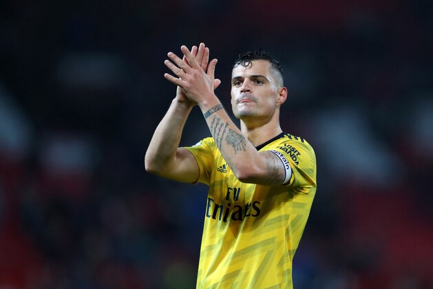 MANCHESTER, ENGLAND - SEPTEMBER 30: Granit Xhaka of Arsenal applauds after the Premier League match between Manchester United and Arsenal FC at Old Trafford on September 30, 2019 in Manchester, United Kingdom. (Photo by Catherine Ivill/Getty Images)